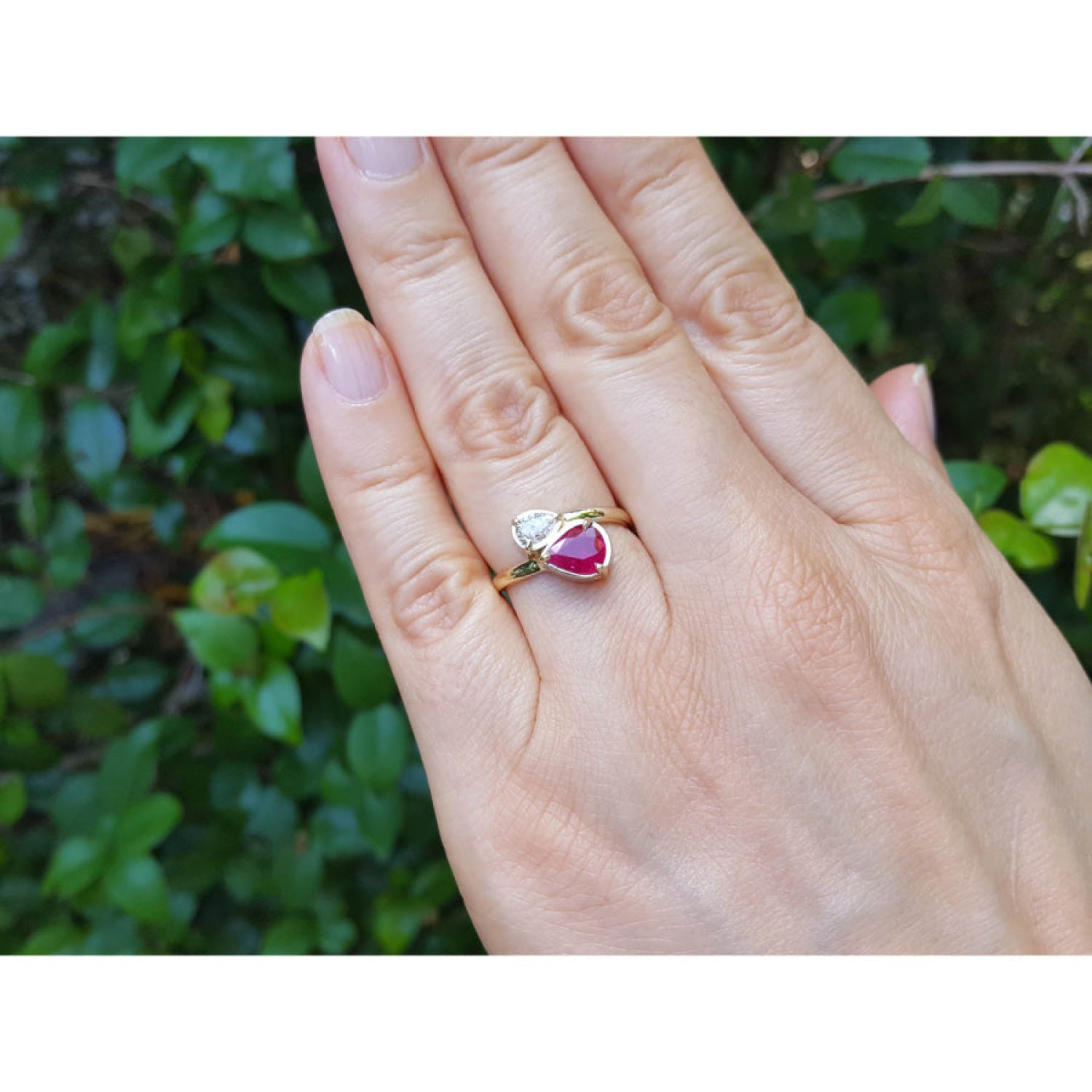 Natural You and Me Ruby Diamond Ring 18K Gold This two stone features a 1.02 ct Burma accentuated by teardrop side