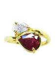 Natural You and Me Ruby Diamond Ring 18K Gold This two stone features a 1.02 ct Burma accentuated by teardrop side diamond.