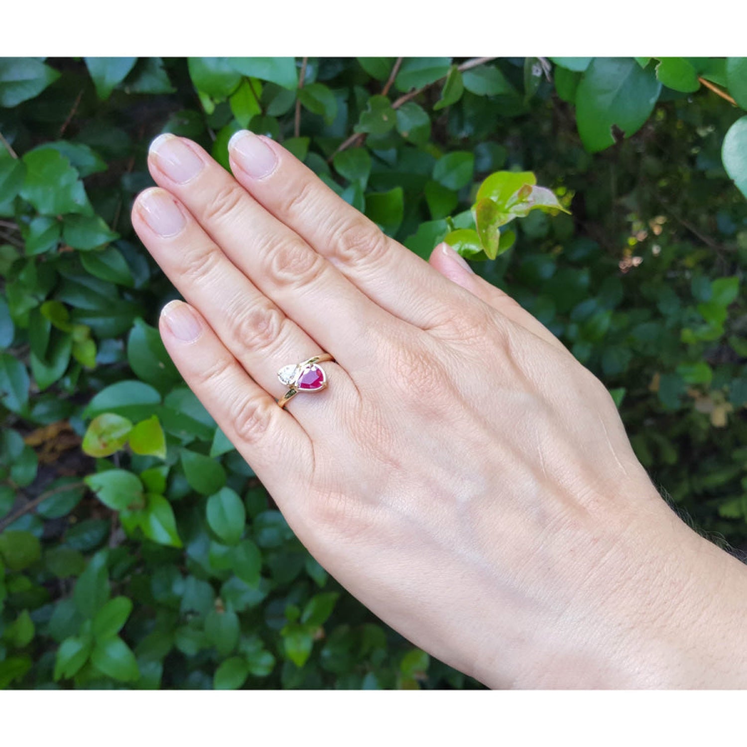 Natural You and Me Ruby Diamond Ring 18K Gold This two stone features a 1.02 ct Burma accentuated by teardrop side.