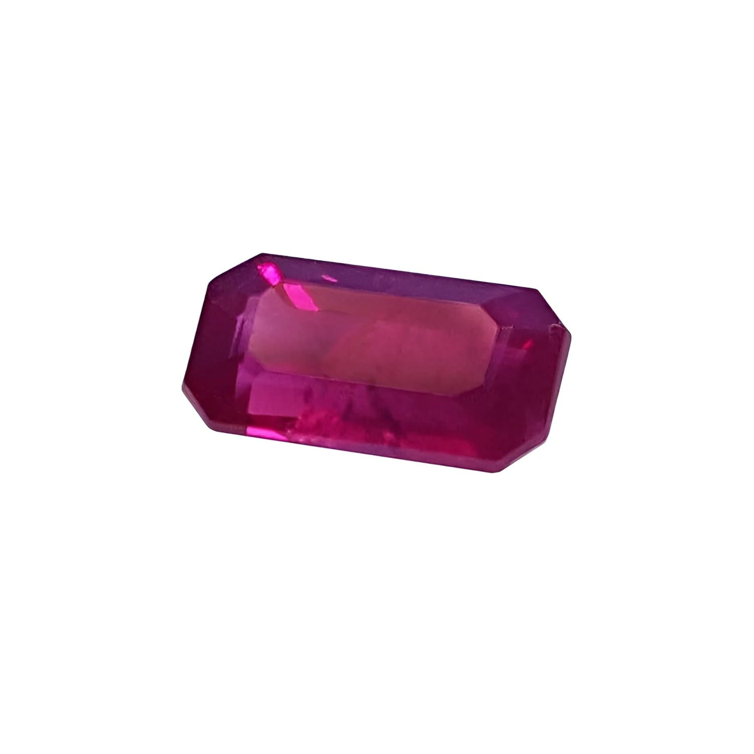 1.11 carat natural emerald-cut ruby gemstone with deep pink-red hue.