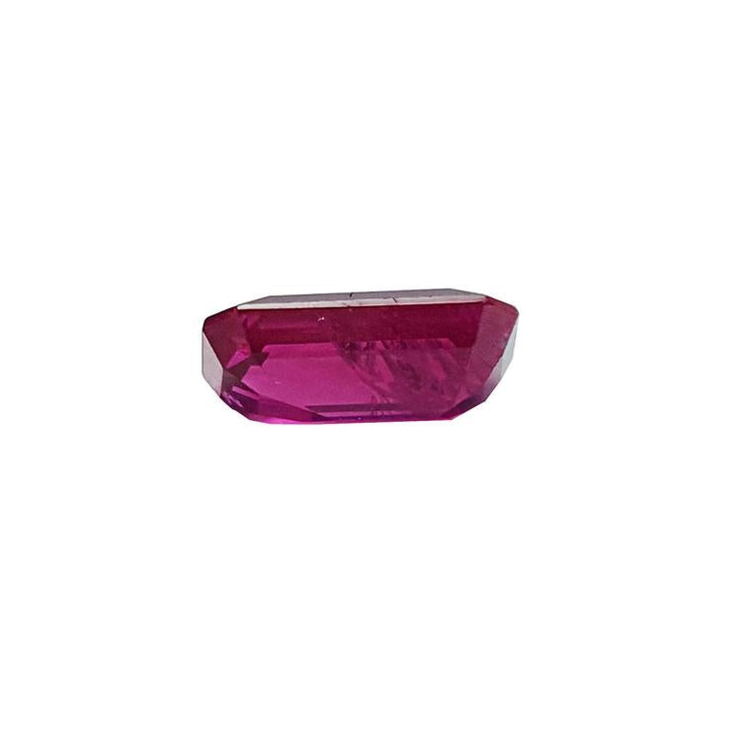 1.11 carat natural emerald cut ruby gemstone with deep pinkish-red color.