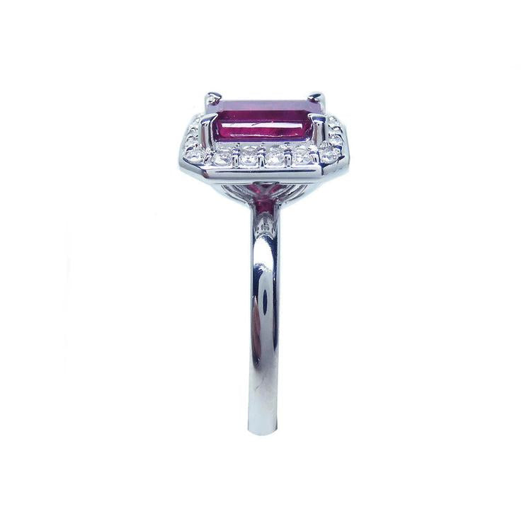 Women's 14K white gold ring with an emerald-cut deep red ruby and diamond halo.