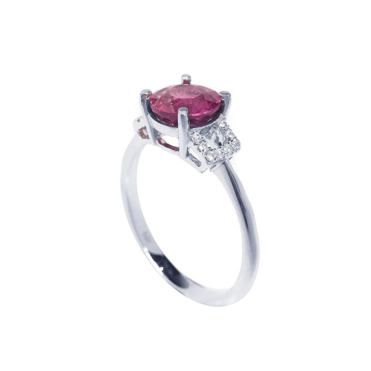 Round cut natural ruby ring with pinkish-red stone, accented diamonds, set in 14k white gold.