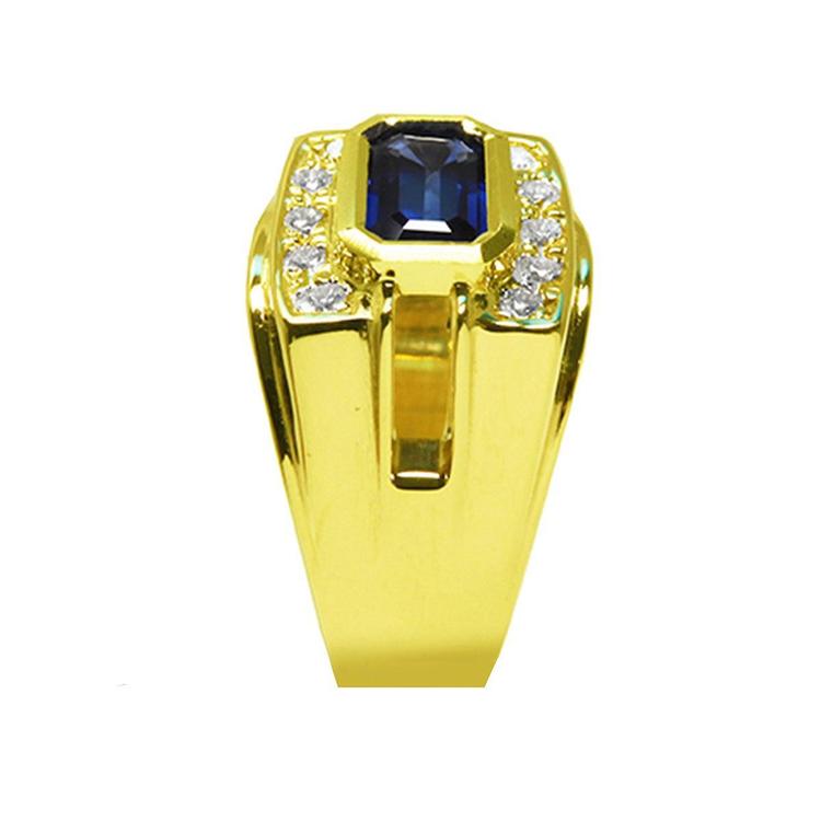 Men's 18K yellow gold ring with east-west bezel-set blue sapphire and diamond accents.
