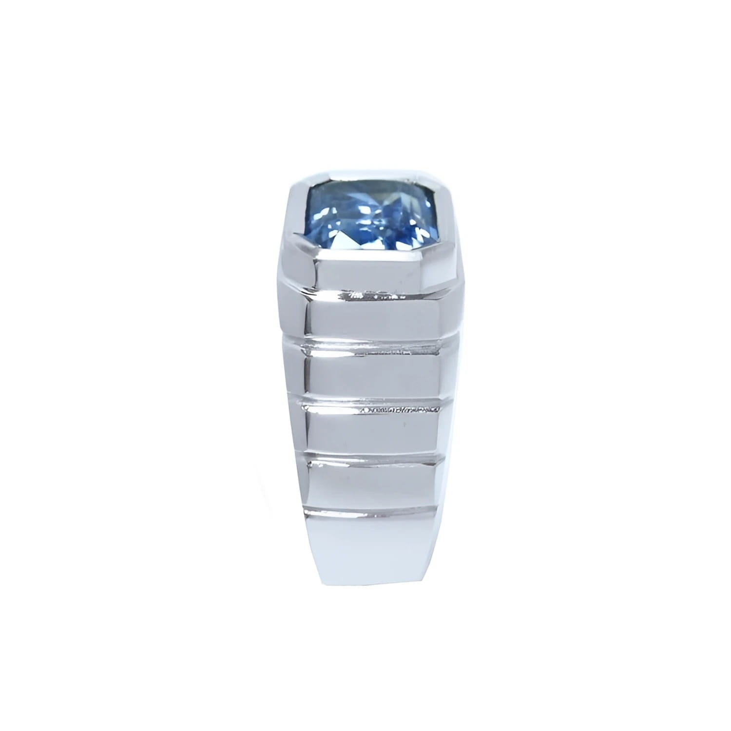 Men's 18K white gold ring with a bezel-set, emerald-cut vivid blue sapphire.