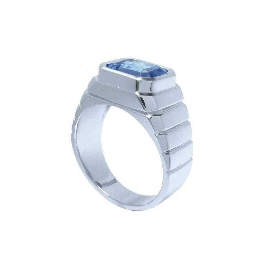 Men's 18K white gold ring with a bezel-set, emerald-cut vivid blue sapphire.