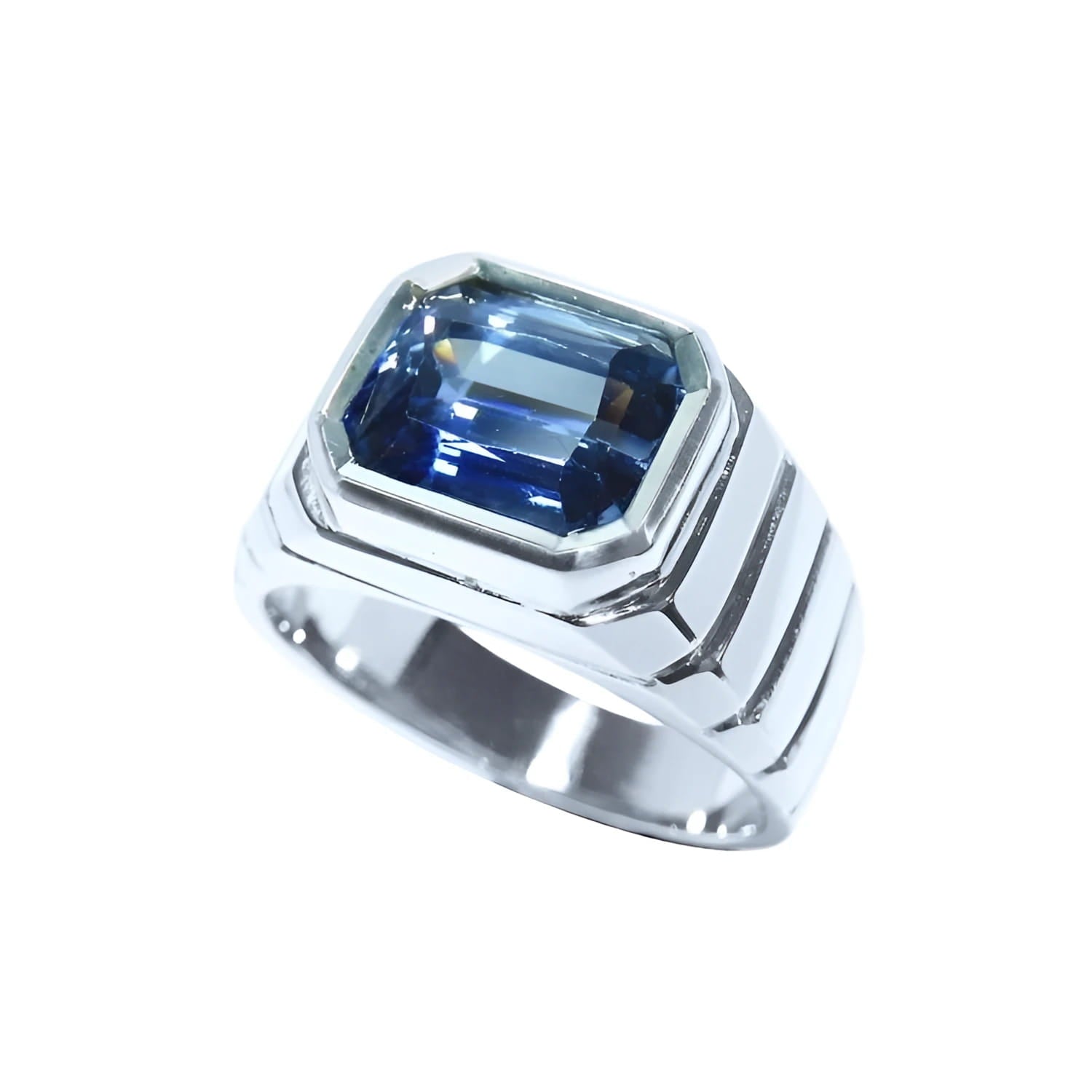 Blue sapphire ring for men emerald cut east west bezel set made of 18K white gold.