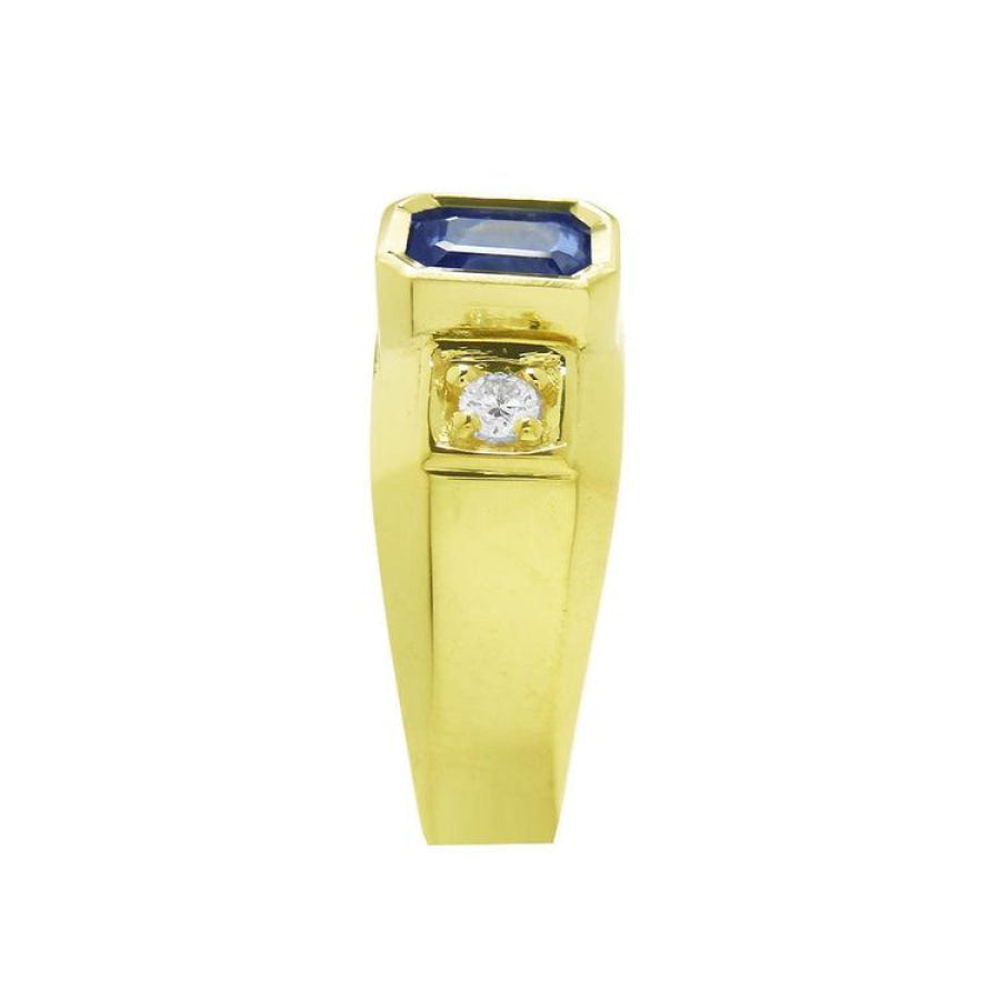 Men's 14K yellow gold ring with an emerald cut blue sapphire and round side diamond.