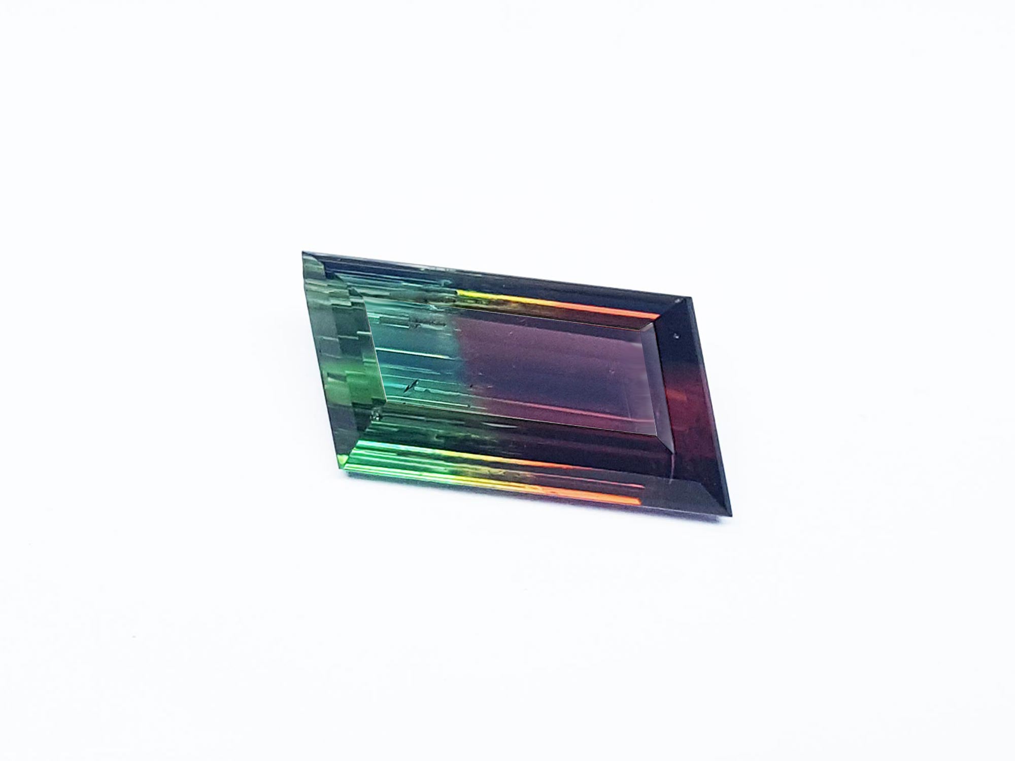 Front position of a loose Brazilian watermelon tourmaline bicolor red orange and green bluish, table and crown visibles