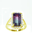 A natural watermelon tourmaline ring with a halo diamond, crafted in 14k yellow gold, from the top-down profile view.