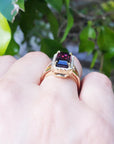 Downside profile view of a watermelon tourmaline ring being wear on a hand.
