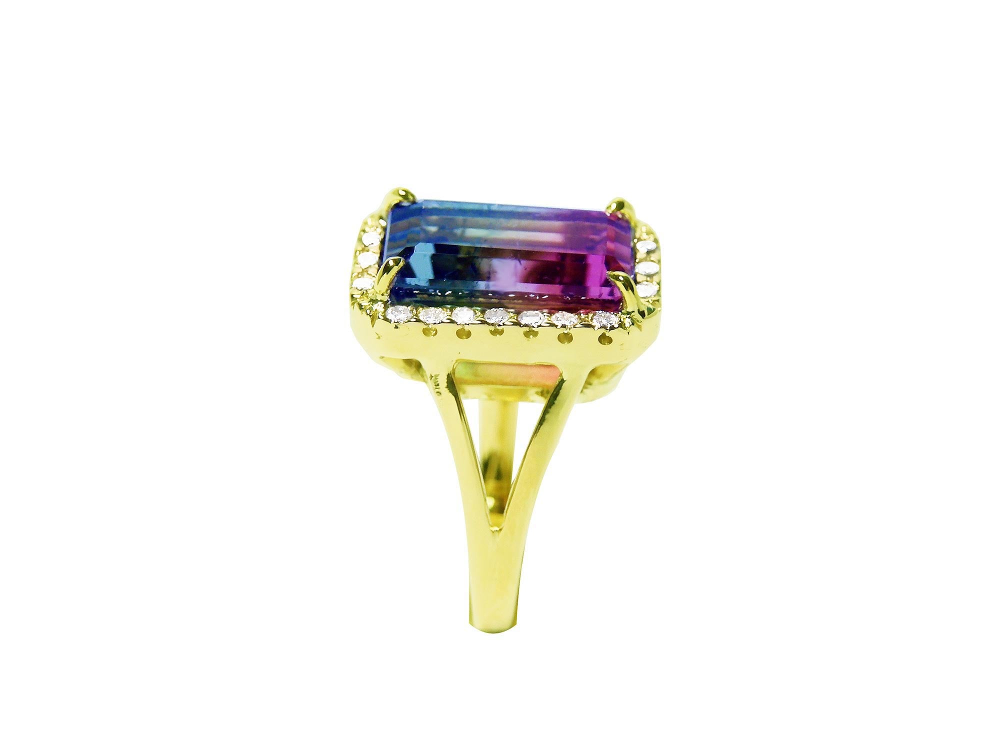 The pink and green of this tourmaline ring are visibles fron the top to side down split shank profile.