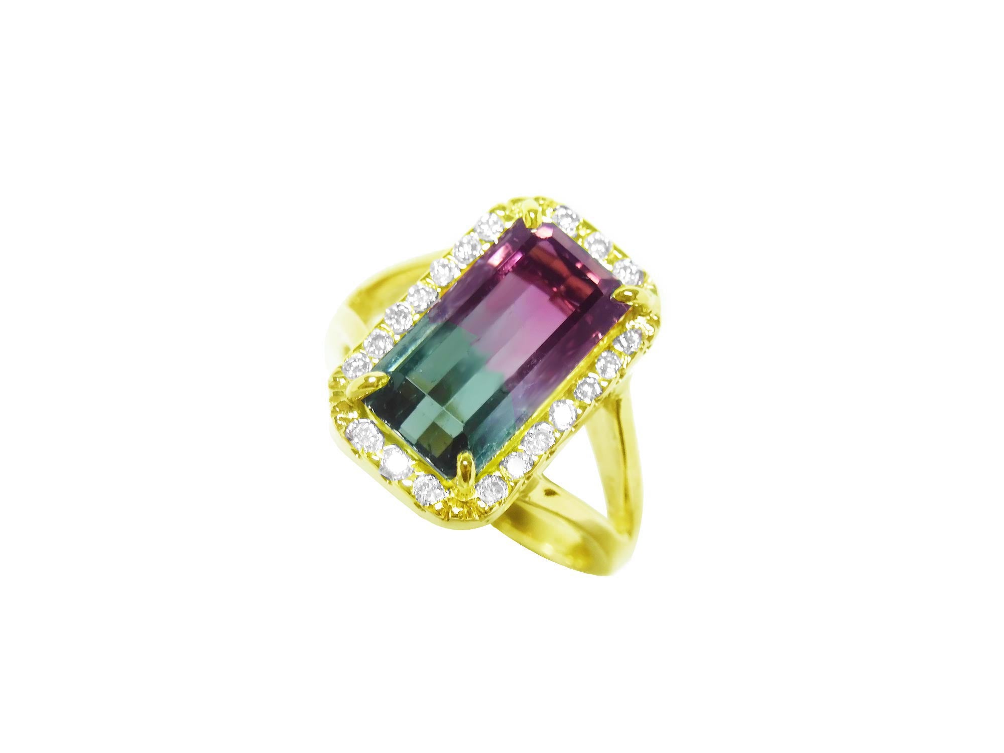 A natural watermelon tourmaline ring with a halo diamond, crafted in 14k yellow gold, tilted left side position top view.