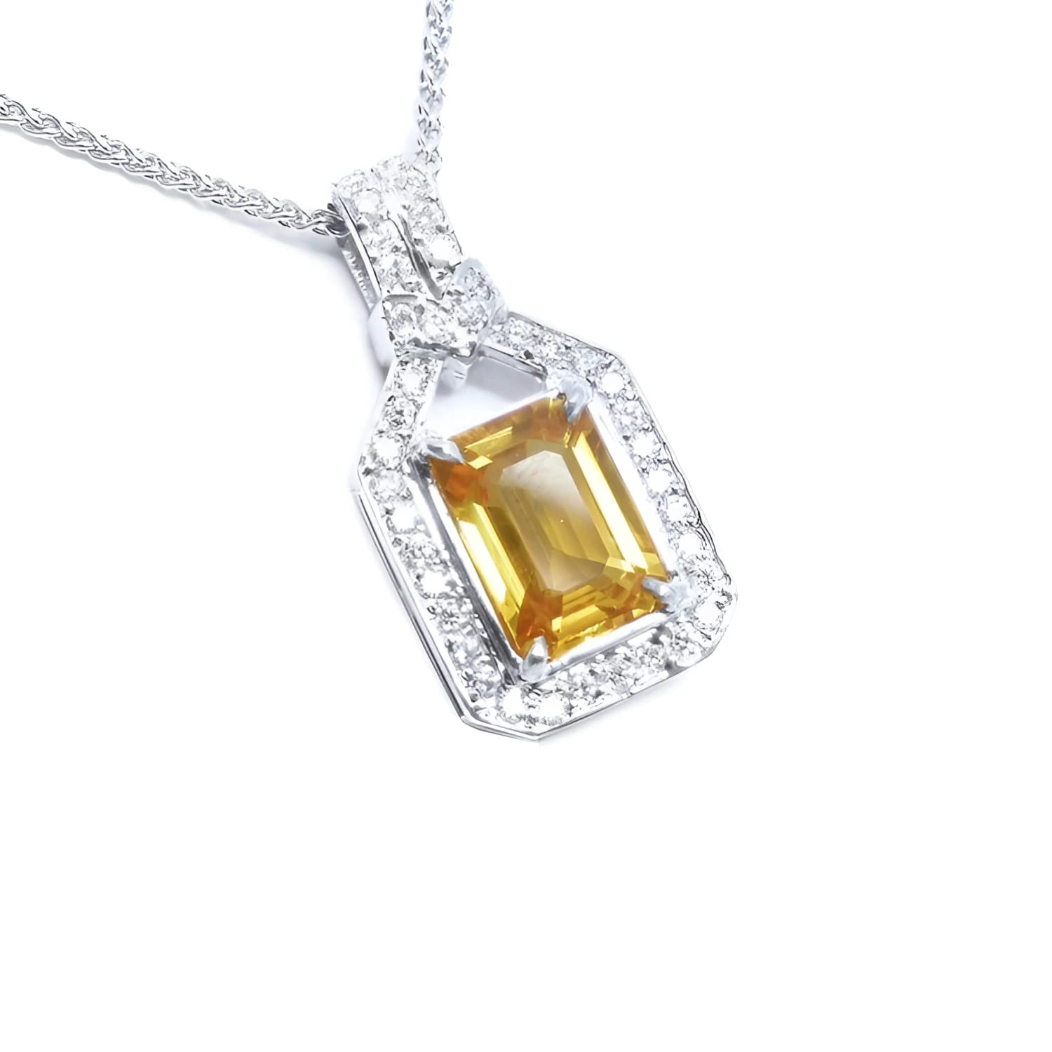 Natural yellow sapphire pendant necklace, the gemstone displays a vibrant medium-deep yellow-orange hue halo diamond 18k white gold.