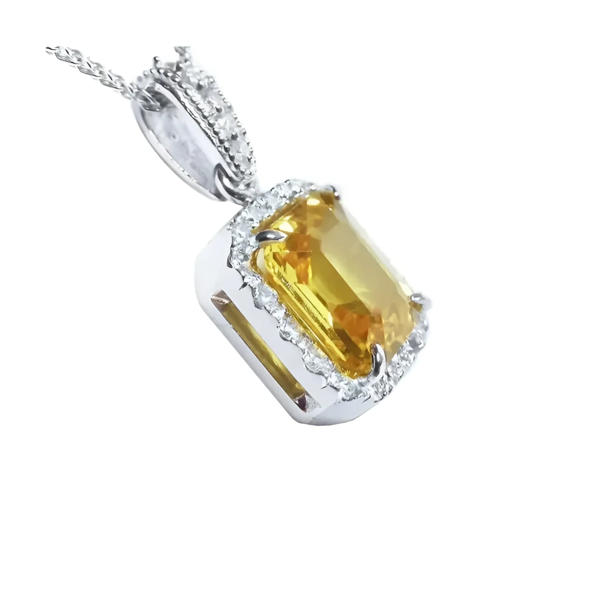 Emerald cut 6.01 ct. yellow sapphire pendant with diamond halo in 18K white gold.
