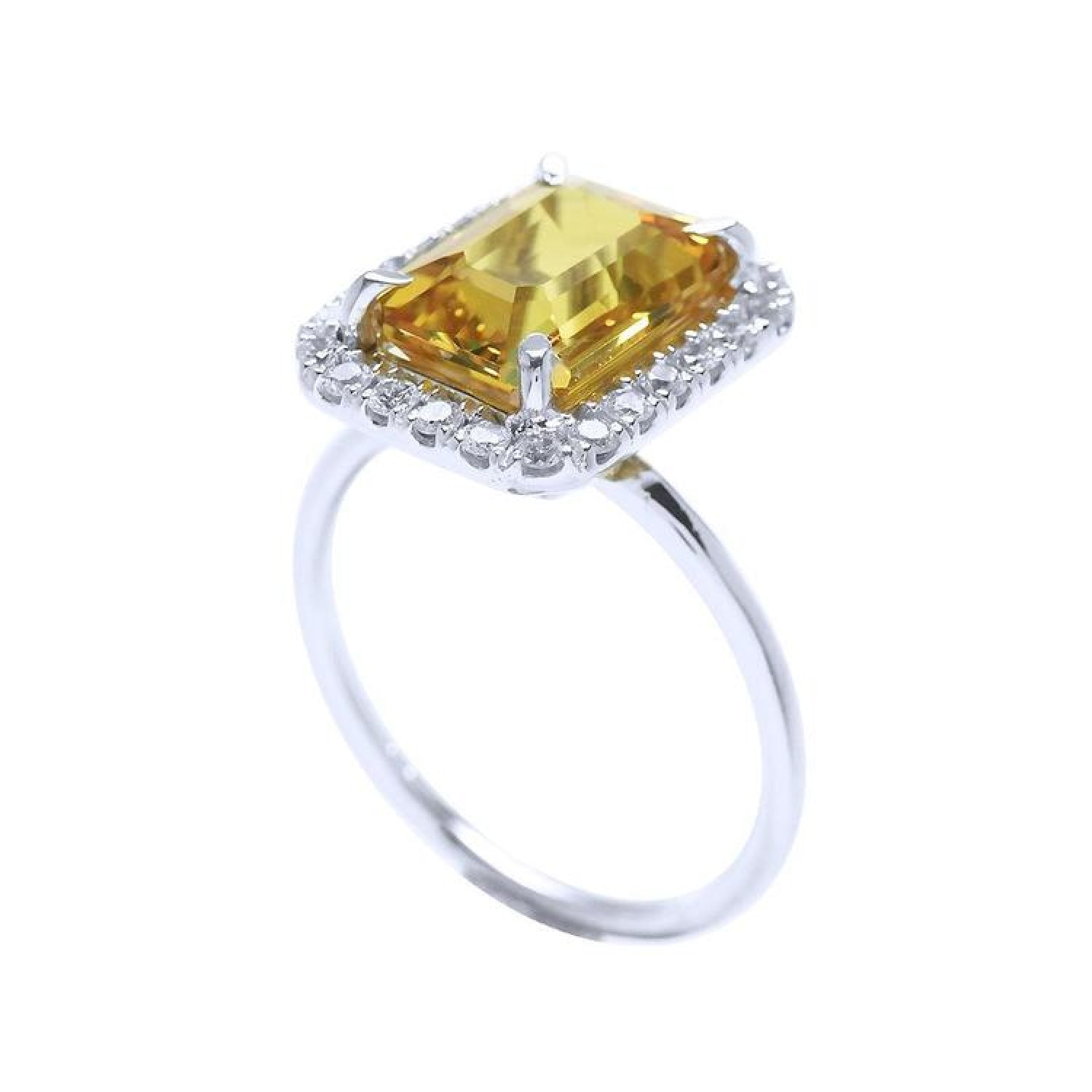 Emerald cut 4.59 ct yellow sapphire ring with diamond halo in 14K white gold.