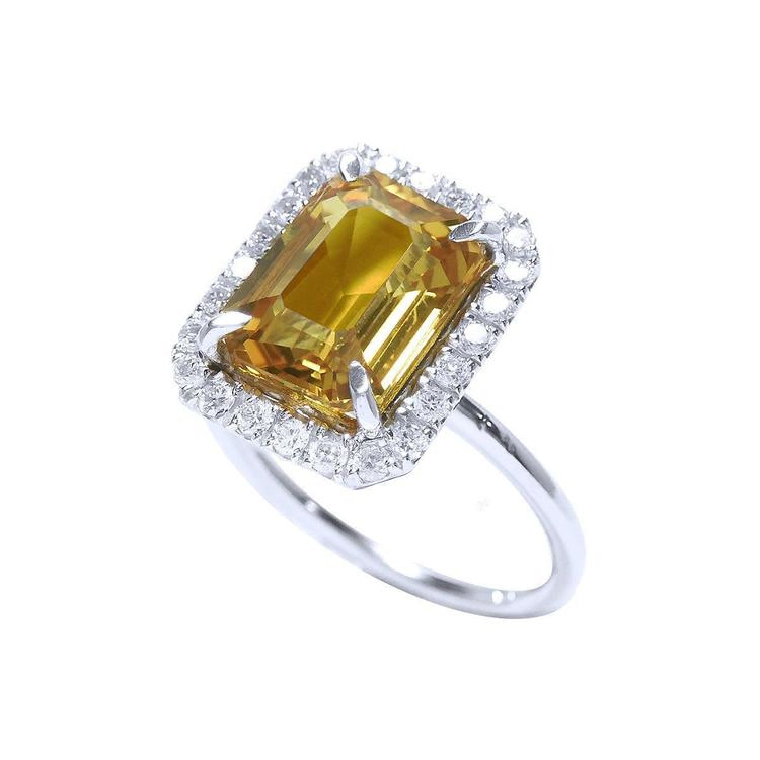 Emerald cut yellow sapphire ring with diamond halo in 14K white gold.