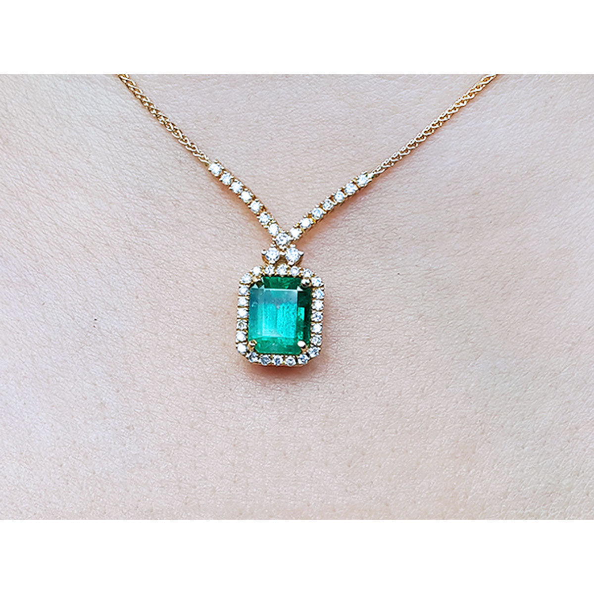 Emerald necklace fo women in usa emerald-cut natural emerald deep green bluish color, encircled by a halo diamond