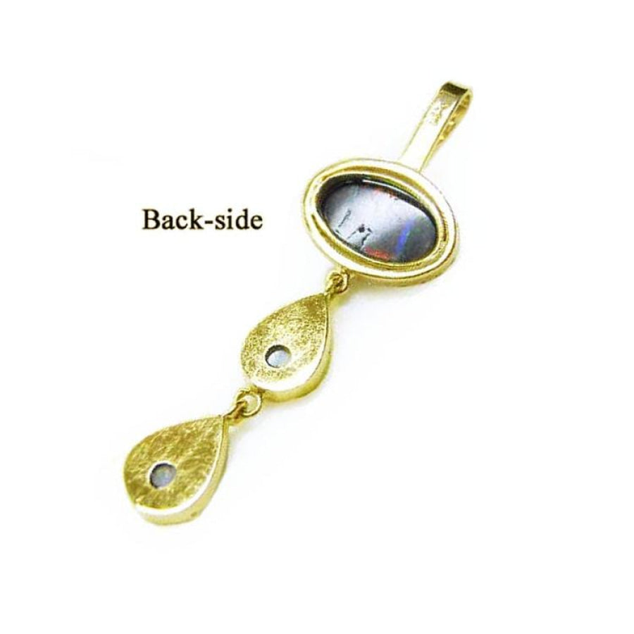 Back-side of a 14K yellow gold pendant with an oval black and white Australian opal and two teardrop accents.