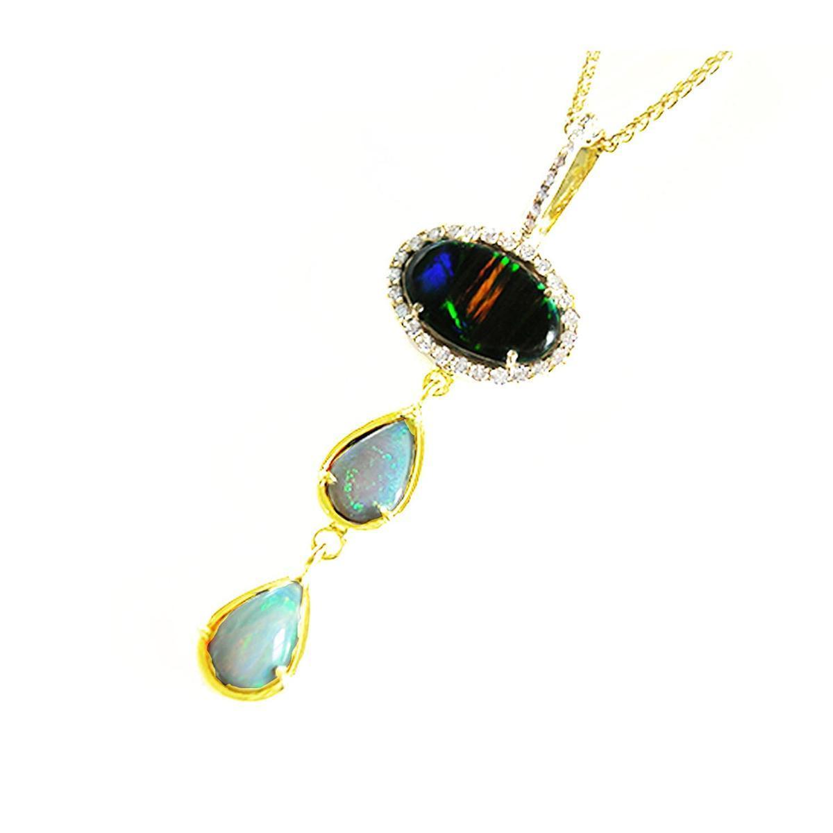 A black and white opal pendant necklace on a left-side view position.