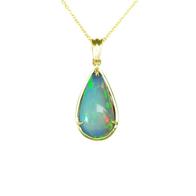 Ethiopian opal pear-shaped pendant with blue/violet play-of-color, set in 14K yellow gold.