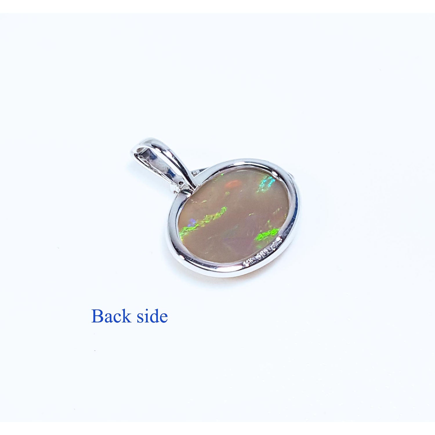 Opal pendant on a white background with &#39;Back side&#39; text.