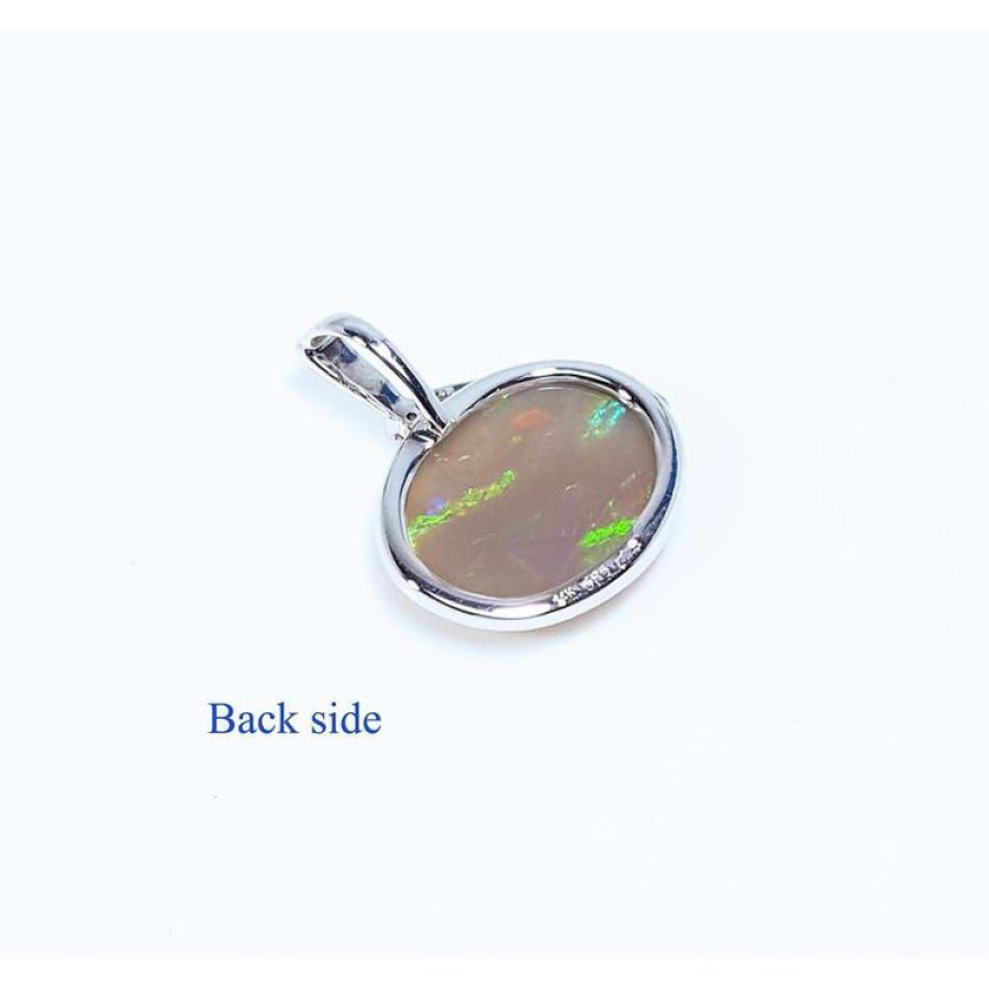 Back of 2.25 ct Australian opal pendant in 14K white gold, showing solid semitransparent white crystal.