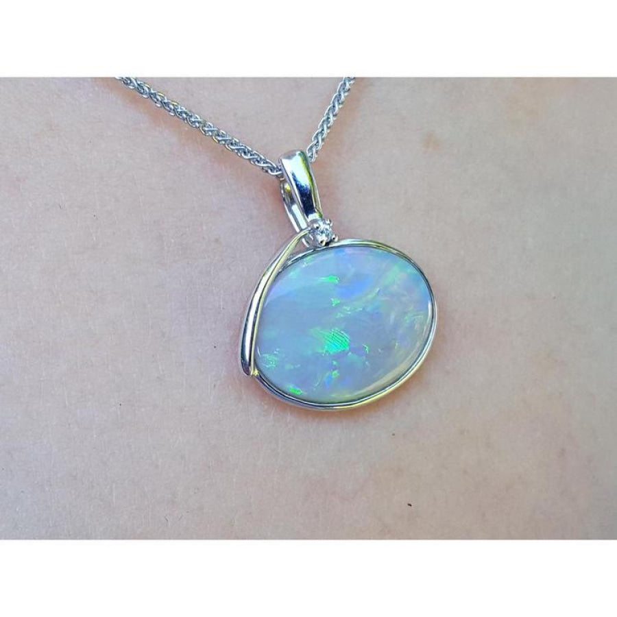 2.25 ct Australian opal pendant in 14K white gold, east-west bezel set with bluish-green flashes.