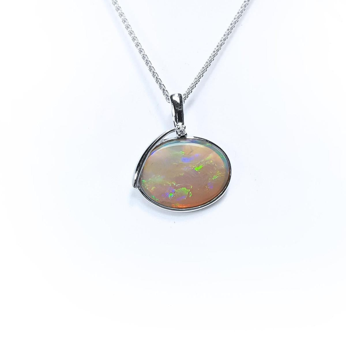 Opal pendant necklace on a white background