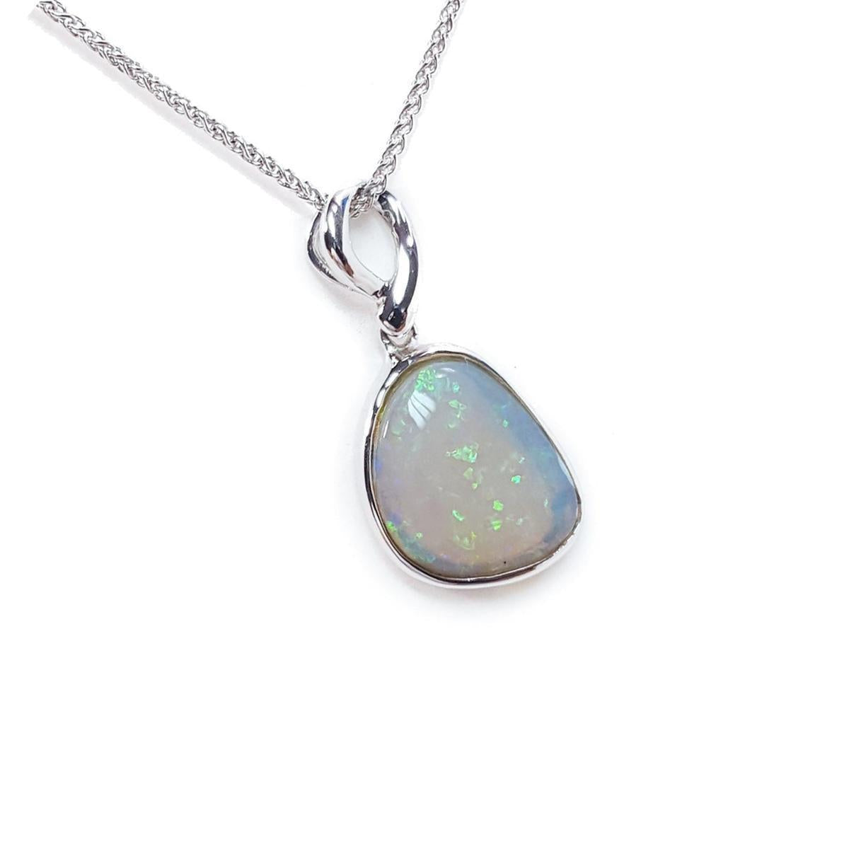 Opal pendant necklace on a white background