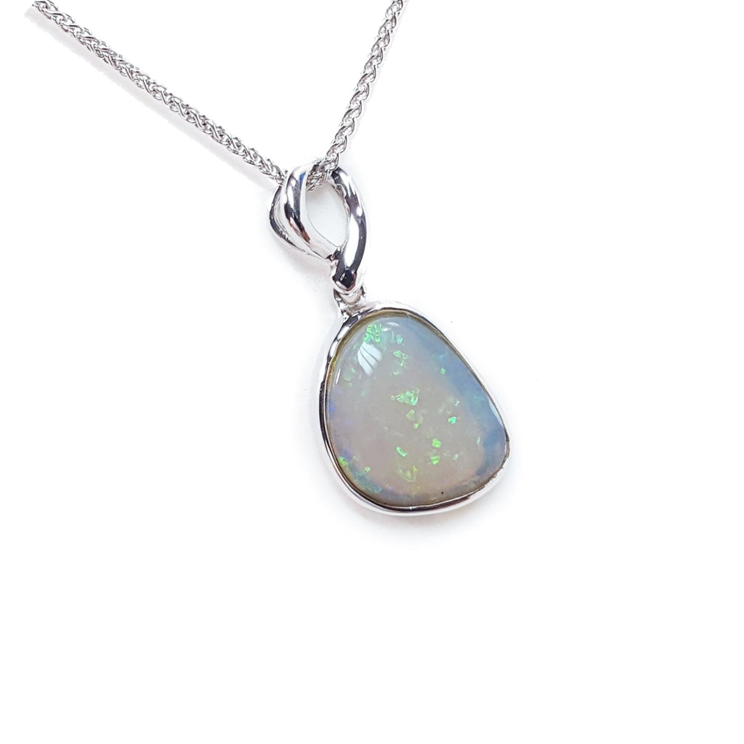 Opal pendant necklace on a white background