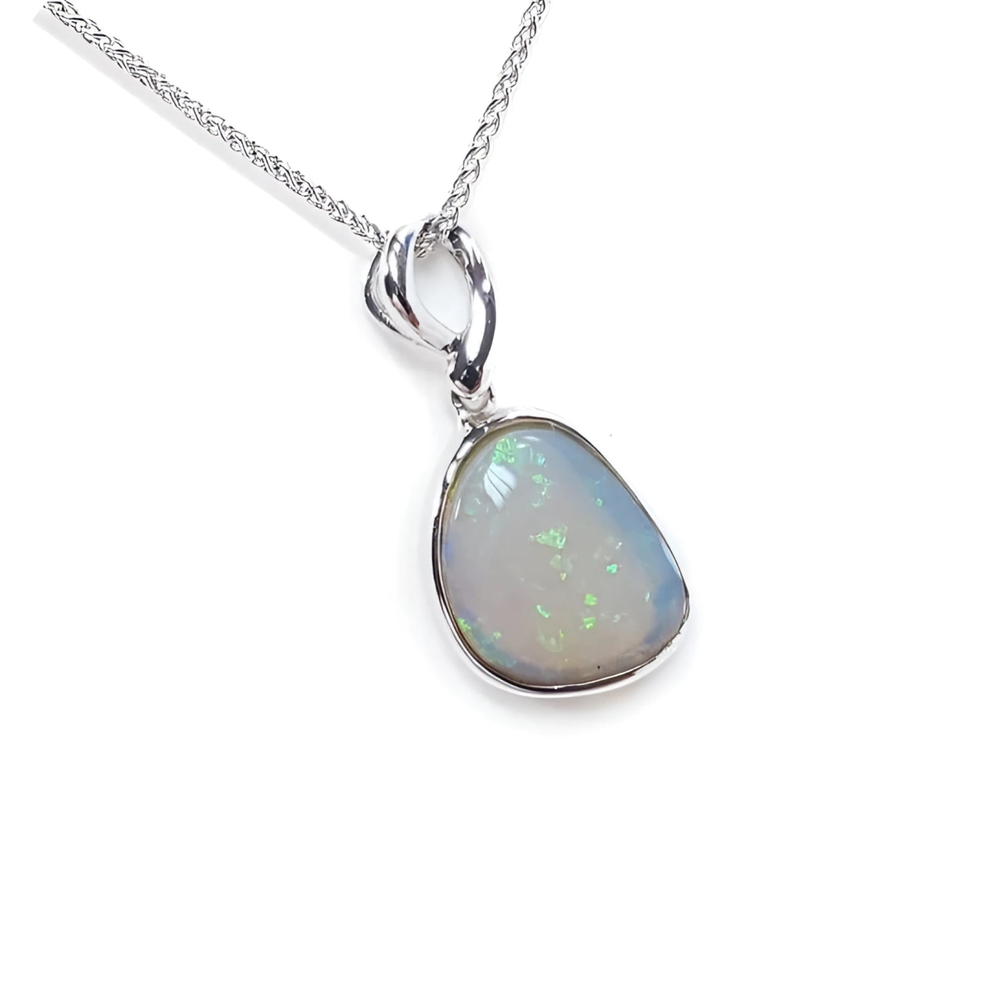Freeform bluish-green Australian opal pendant, bezel set in 14K white gold with a chain.