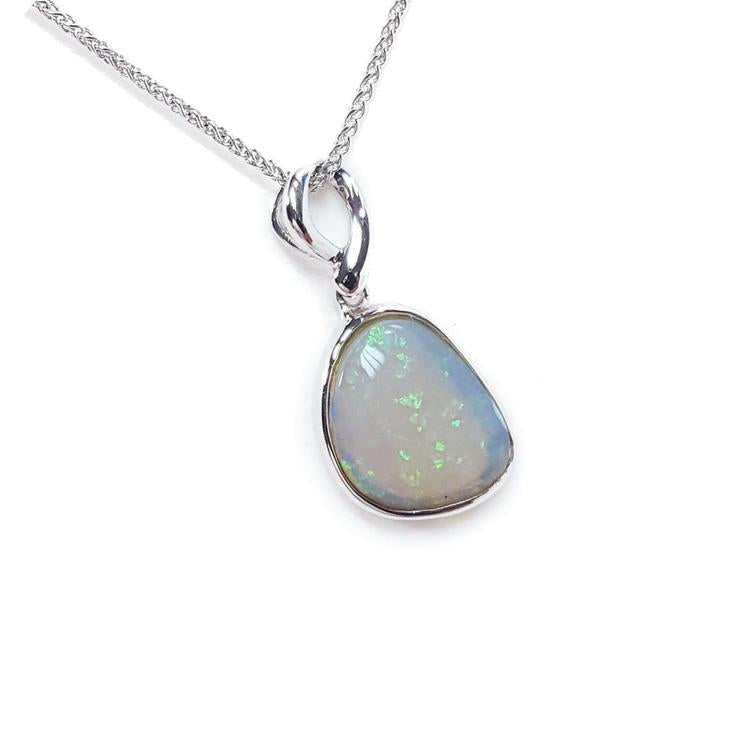 Opal pendant necklace on a white background