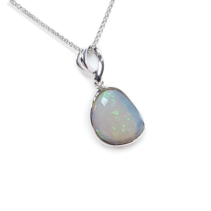 Freeform bluish-green Australian opal pendant, bezel set in 14K white gold with a chain.