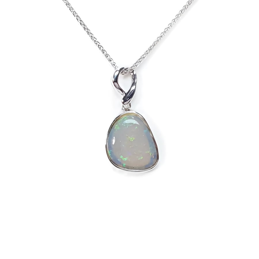 Freeform bluish-green Australian opal pendant, bezel set in 14K white gold on a silver chain.