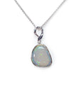 Opal pendant on a white gold chain against a white background