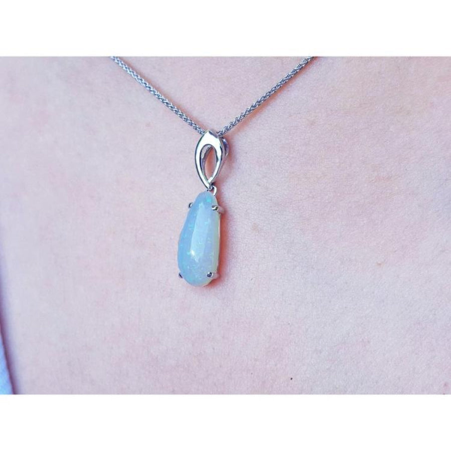 Pear-shaped 2.12 ct. white opal solitaire pendant in 14K white gold on a silver chain.