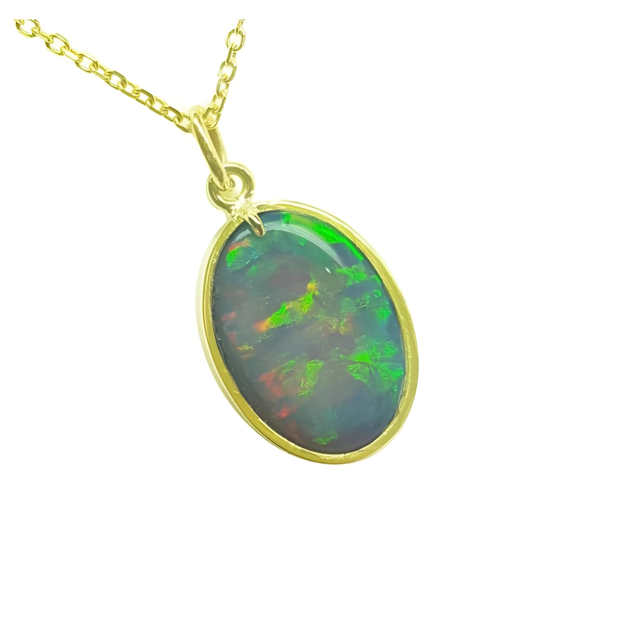 Oval Australian opal pendant with green-bluish rainbow play, set in 14K yellow gold.