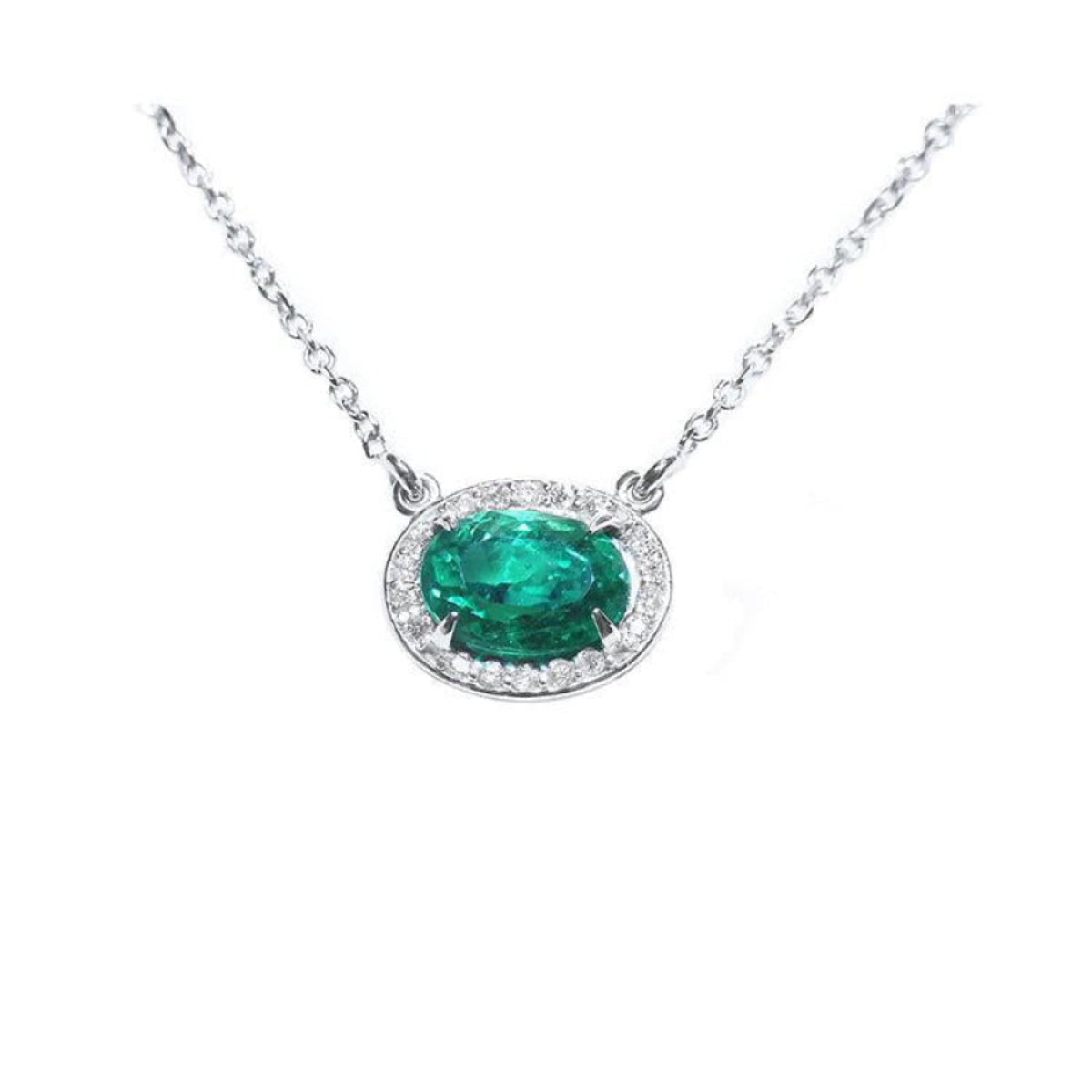 1.00 ct. oval emerald necklace in 14K white gold with diamond halo.