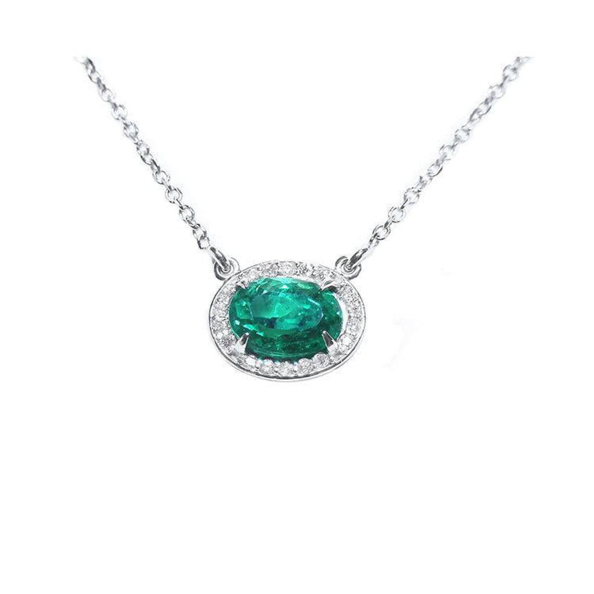 1.00 ct. oval emerald necklace in 14K white gold with diamond halo.