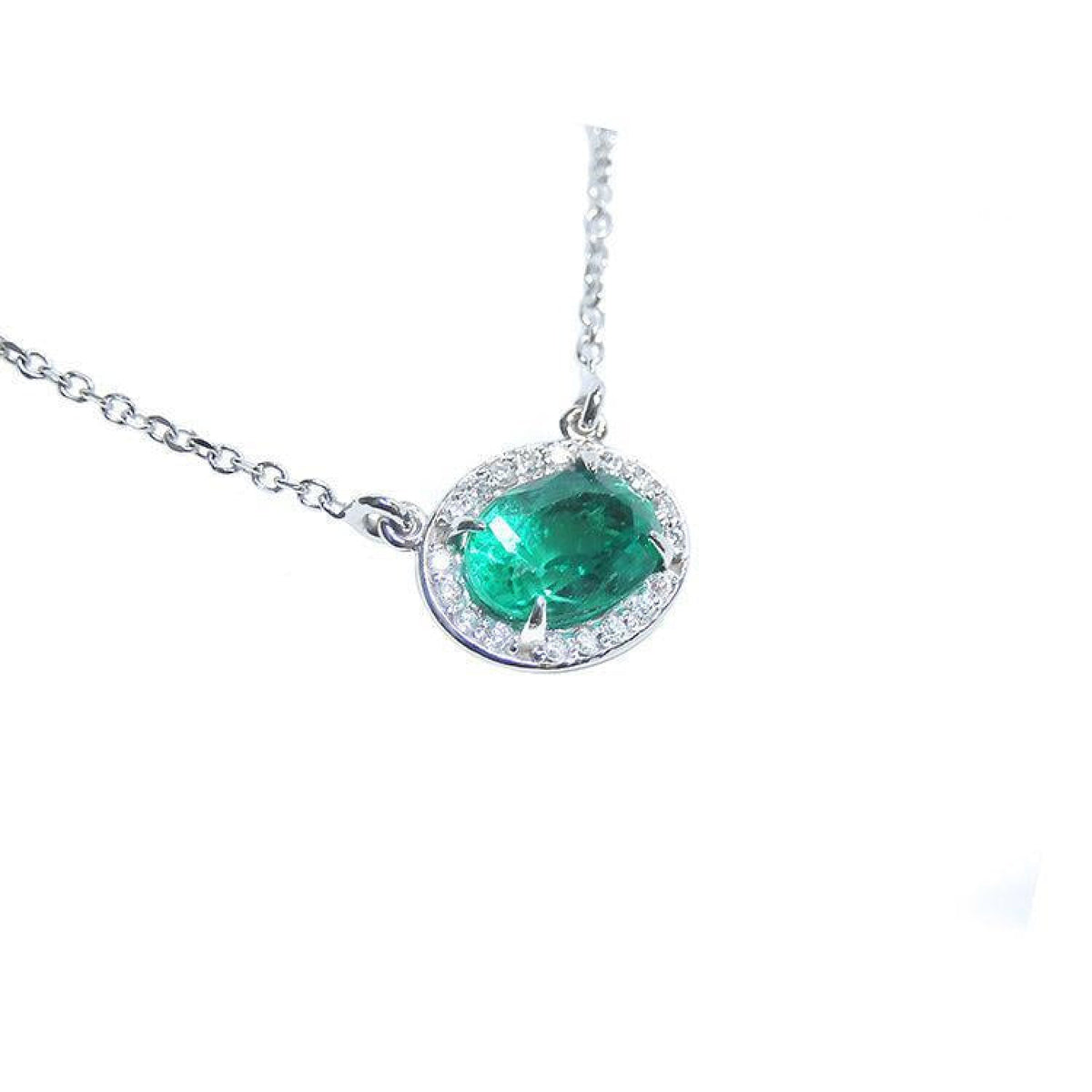 Oval cut emerald necklace east west orientation halo natural diamonds prong set crafted in 14k white gold
