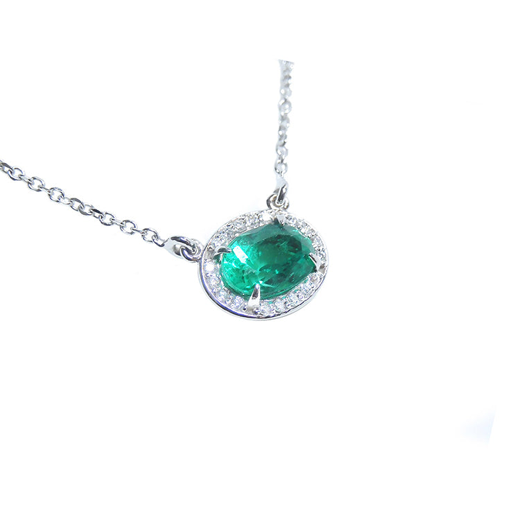 Oval cut emerald necklace east west orientation halo natural diamonds prong set crafted in 14k white gold