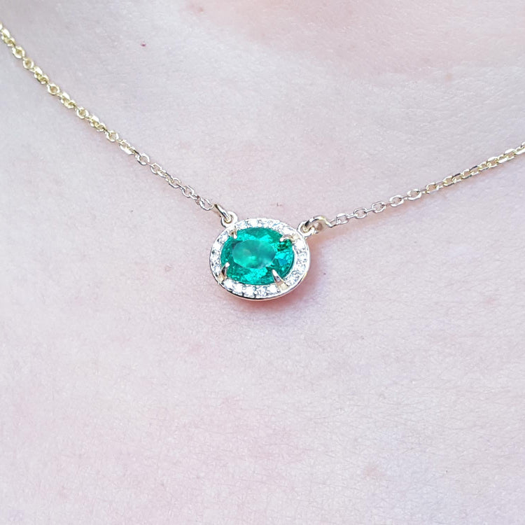 Halo natural diamond Emerald necklaces for sale from Muzo mines Colombia, crafted in 14k yellow gold
