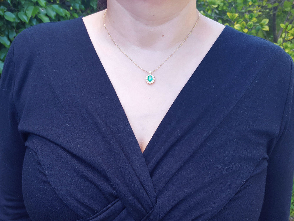 Emerald women&#39;s necklaces natural Muzo mine oval cut 1.11 carats encircled by halo diamonds crafted in 14k yellow gold