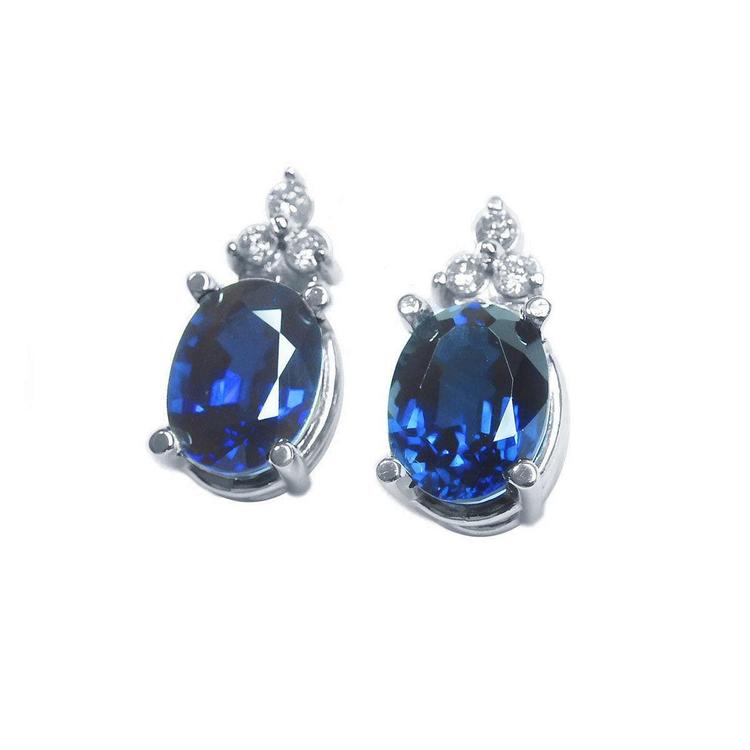 Natural blue sapphire earrings oval cut stud diamonds white gold, left side view
