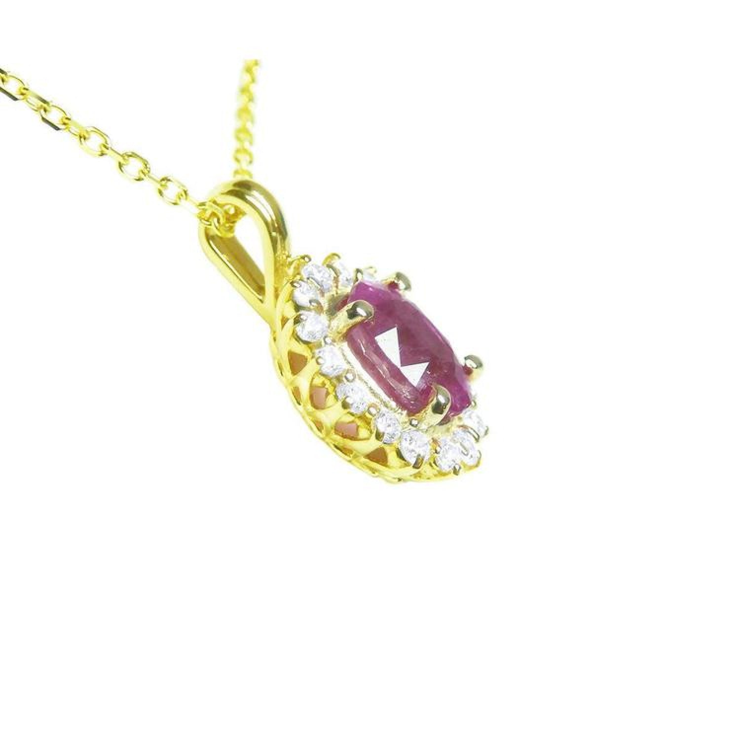 14K yellow gold necklace pendant with an oval pink sapphire and diamond halo.