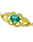 14k yellow gold bracelet with an oval cut natural emerald and accent diamonds for women.