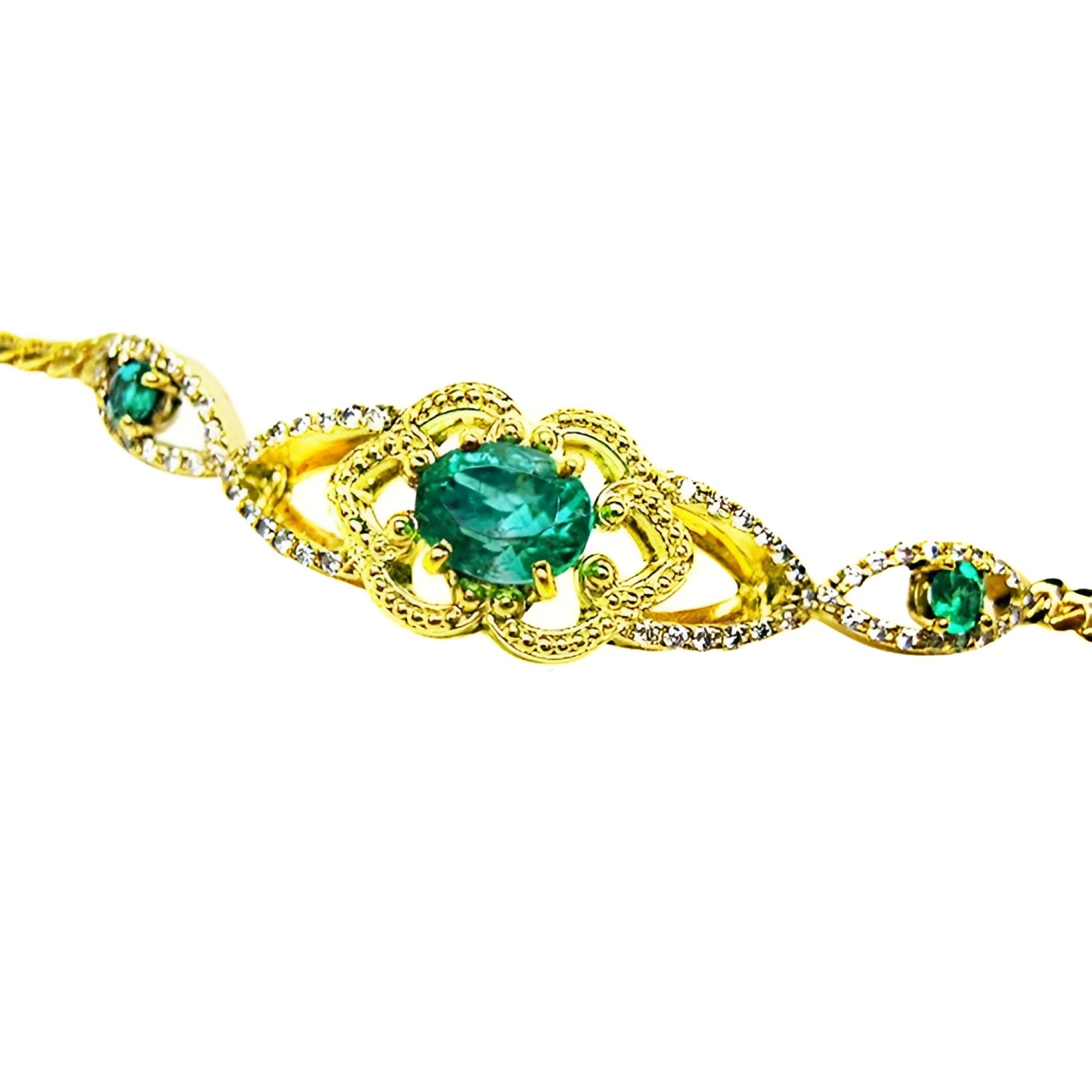 Vintage 14K yellow gold bracelet with oval emeralds and natural diamonds.