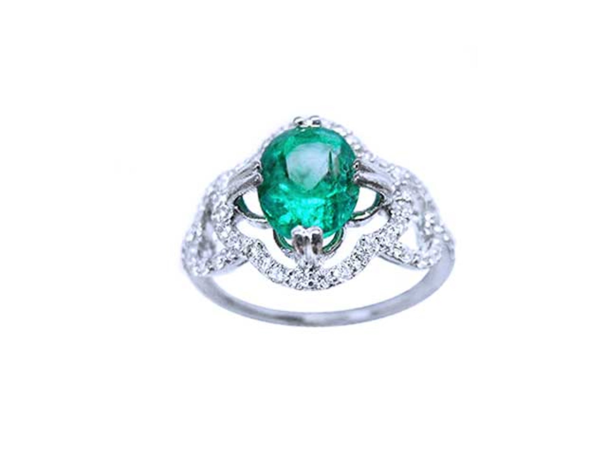 An oval cut Colombian emerald in the center of a clover ring design adorned with natural diamonds.