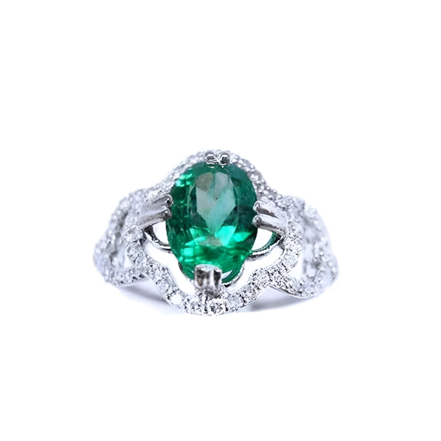 This oval-cut emerald, elegantly set at the heart of a four-leaf clover design framed by a halo of diamonds is in 14K gold.